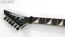 Cargar imagen en el visor de la galería, Jackson X Series RRXMG Rhoads Black with White Pinstripes
